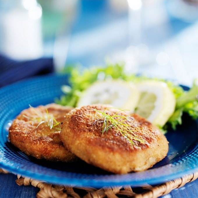 Crab cakes on blue plate