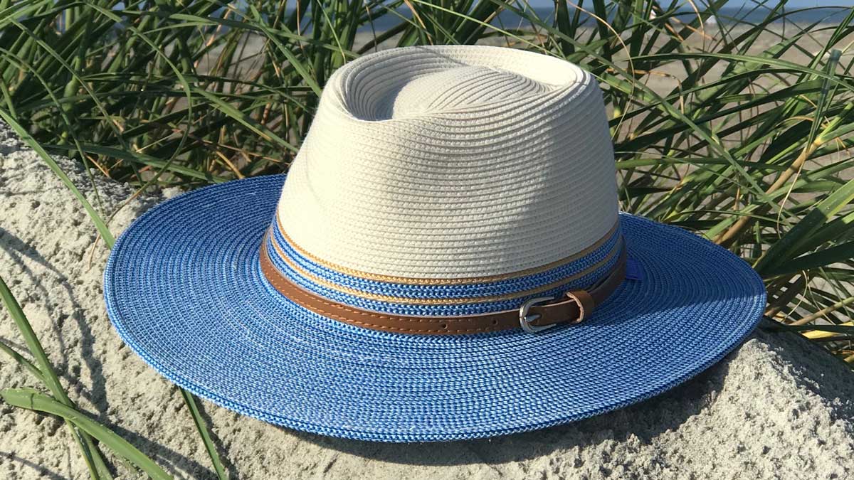 Blue and white sun hat on the beach