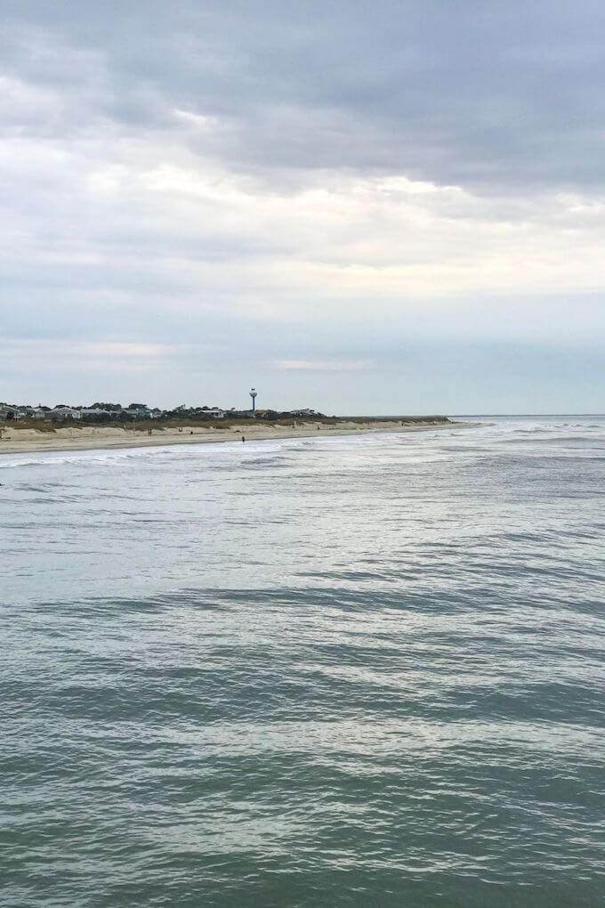 A view of the Tybee Island shoreline with the Tybee Lighthouse in the distance