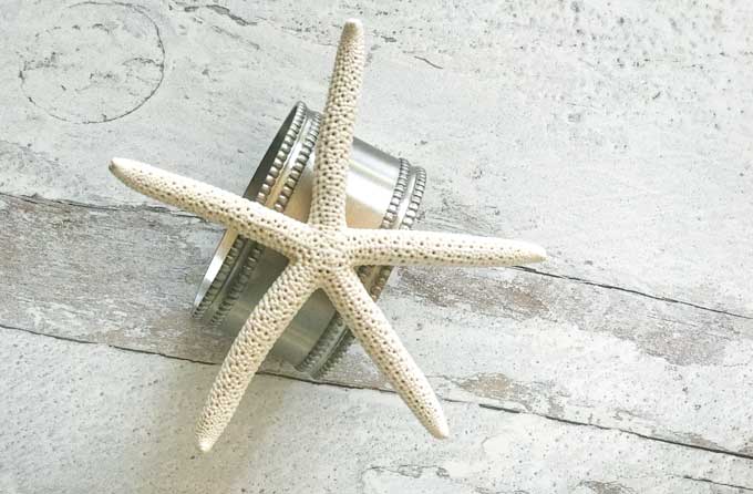 Starfish napkin ring on weathered wood