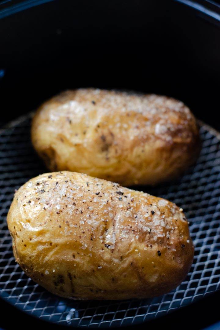 Baked potatoes in air fryer basket