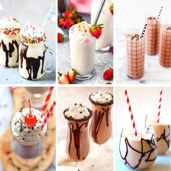 Alcoholic shakes with chocolate syrup, whipped cream, and strawberries
