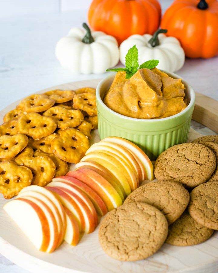 Pumpkin cheesecake dip with ginger snaps, apples, pretzels