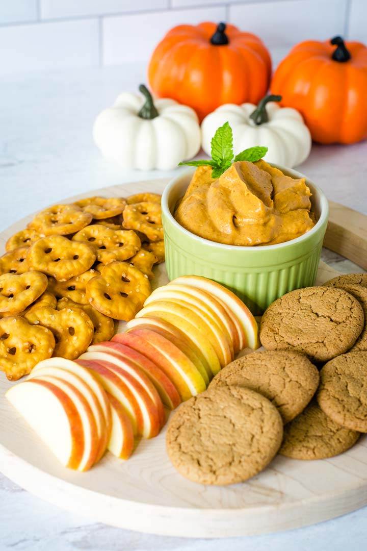 Pumpkin cheesecake dip with ginger snaps, apples, pretzels