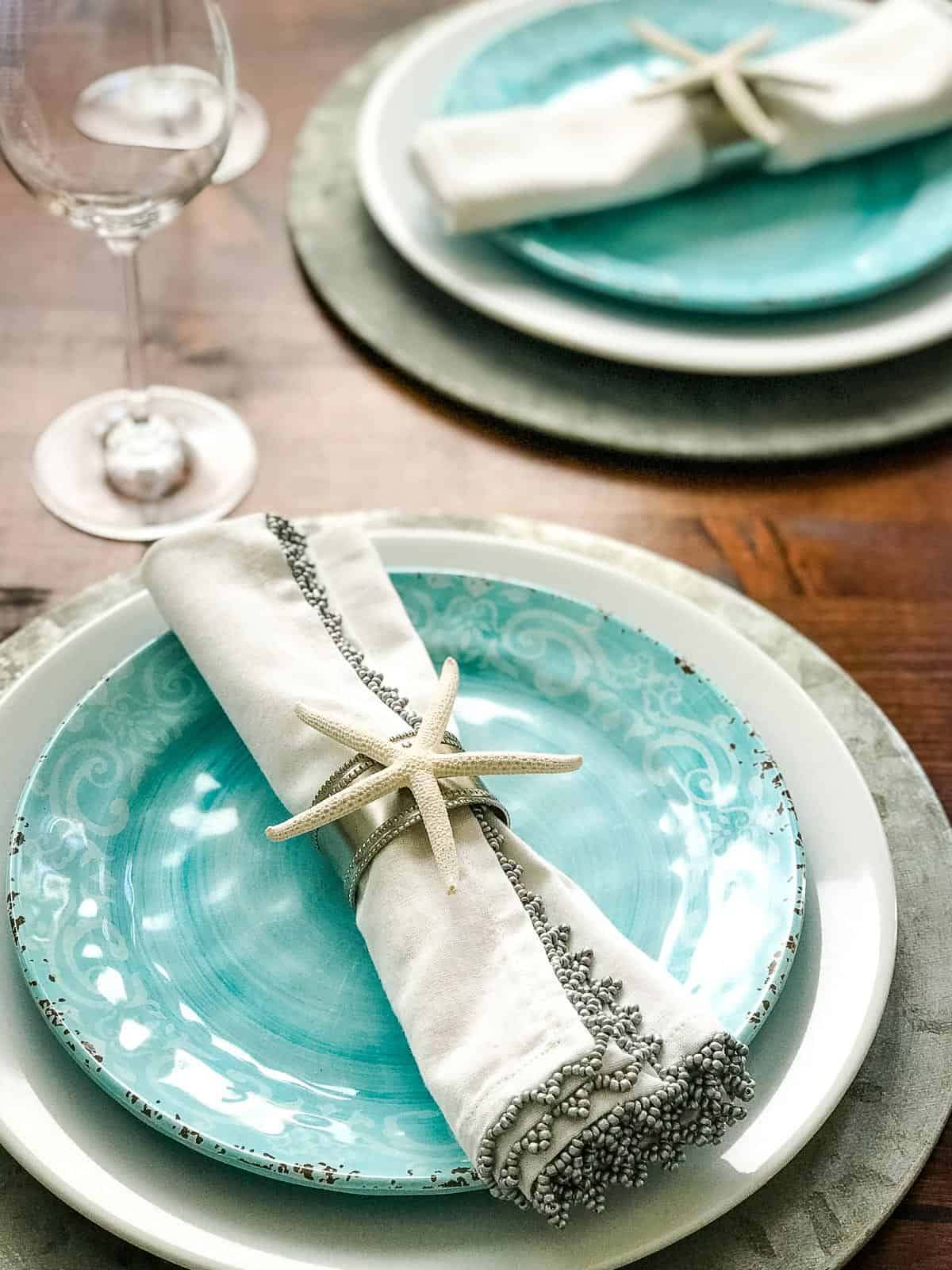 DIY coastal napkin ring on blue plate