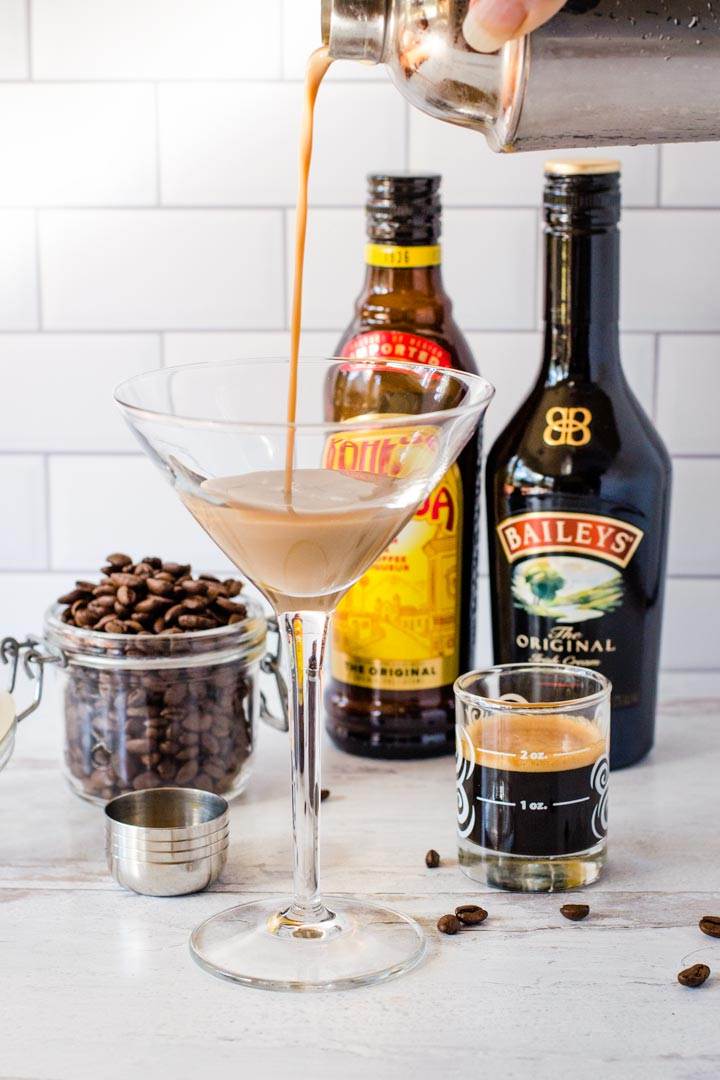 Coffee cocktail pouring into glass