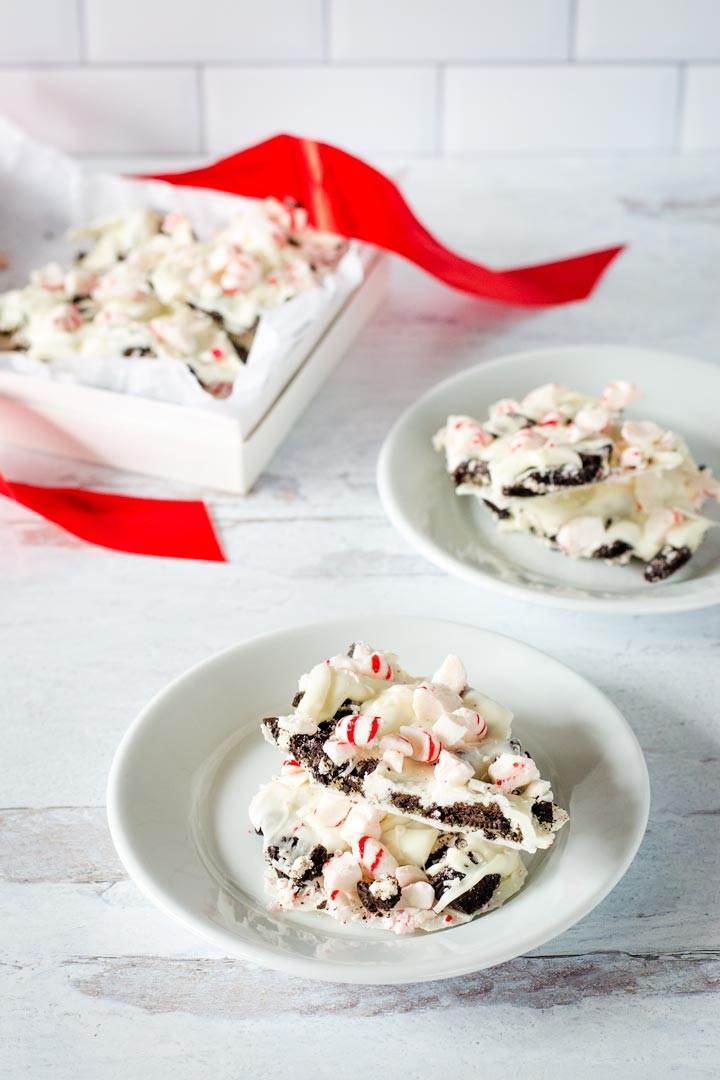 Peppermint bark pieces on plates with gift box