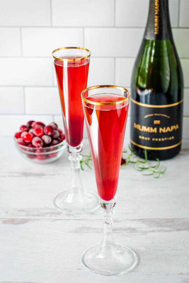 Champagne flutes with pomegranate mimosas