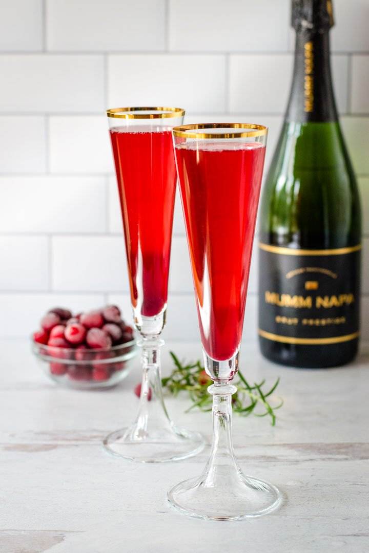 Pomegranate mimosas,champagne, cranberries, rosemary