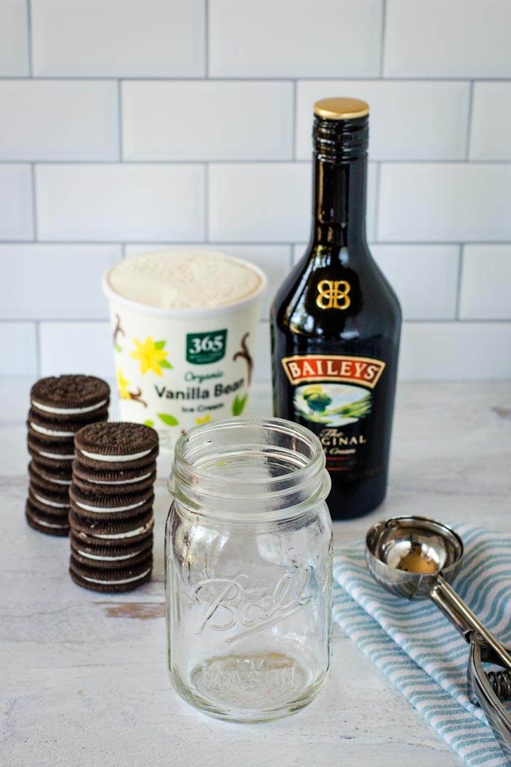 Chocolate sandwich cookies, ice cream, Baileys, mason jar, scoop, napkin