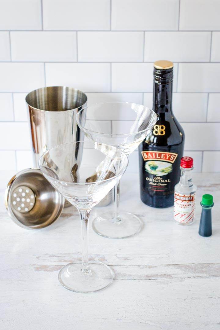 Cocktail shaker, martini glasses, Baileys, vodka, green coloring