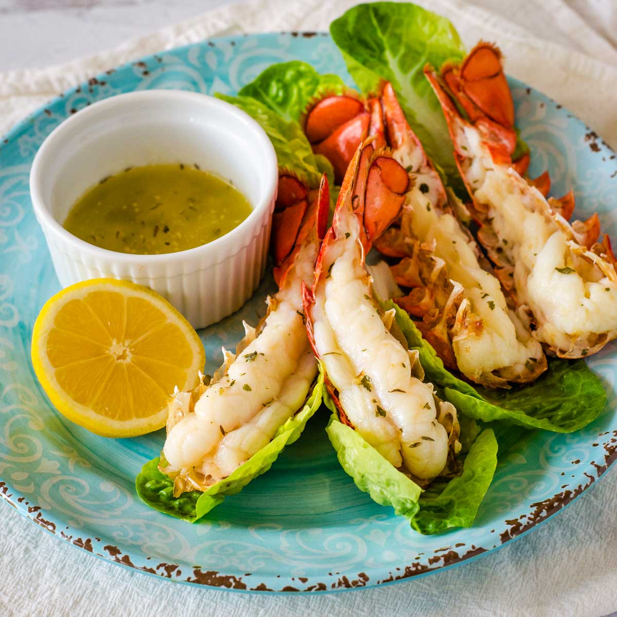 Air fryer lobster tails with herb garlic butter and lemon