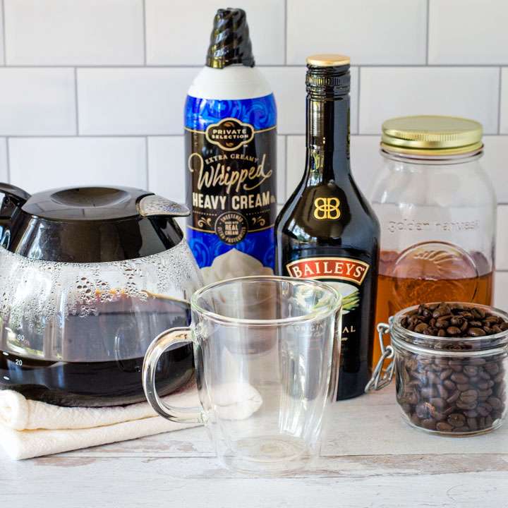 Coffee pot, whipped cream, Bailey, whiskey, coffee beans, glass mug
