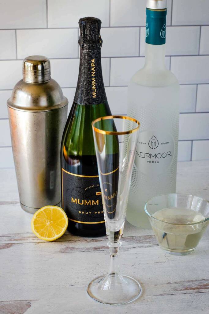 Cocktail shaker, champagne, vodka, lemon, simple syrup