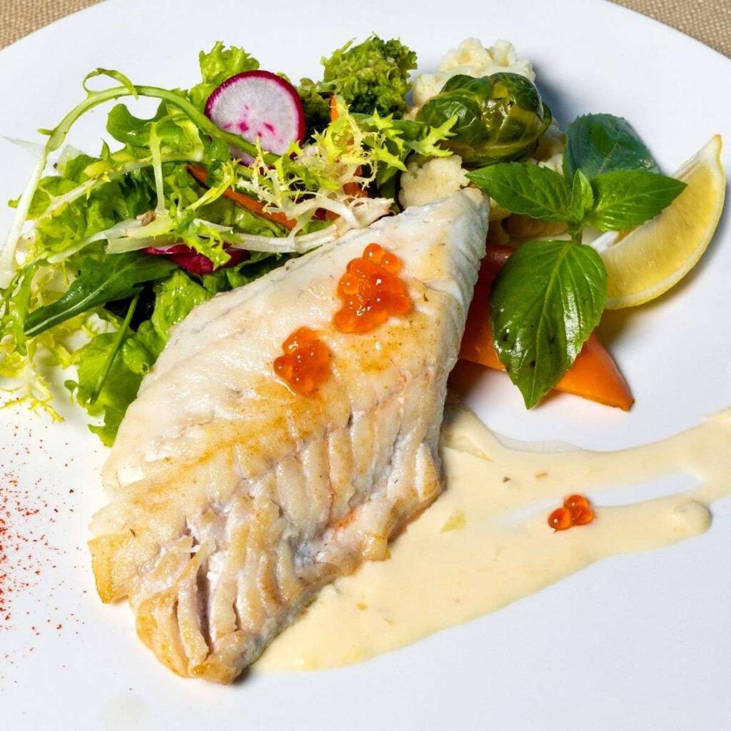 Simple haddock served with salad