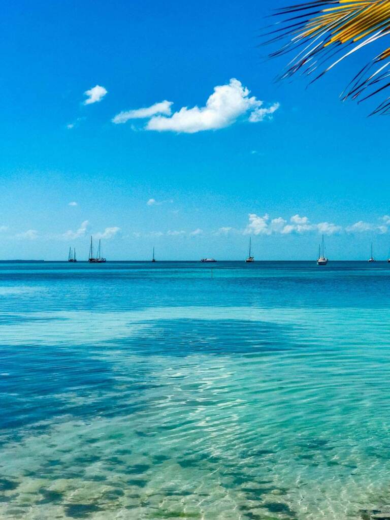 Caye Caulker blue water and sailboats