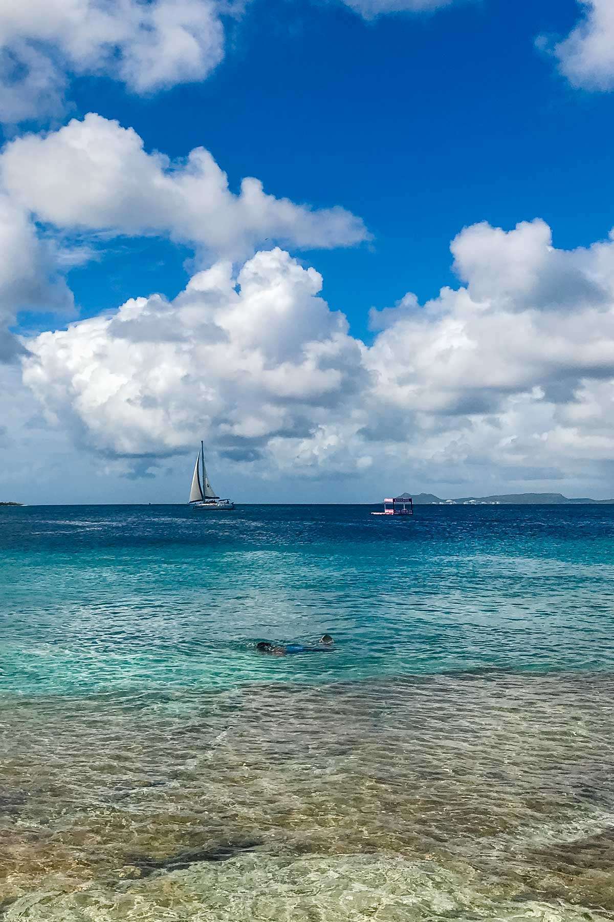 Snorkeler and sailboat