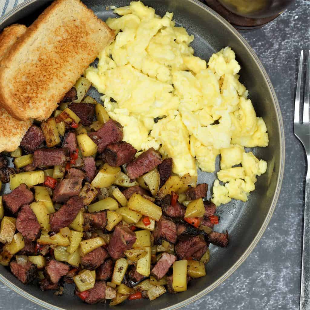 Pastrami hash with scrambled eggs and toast
