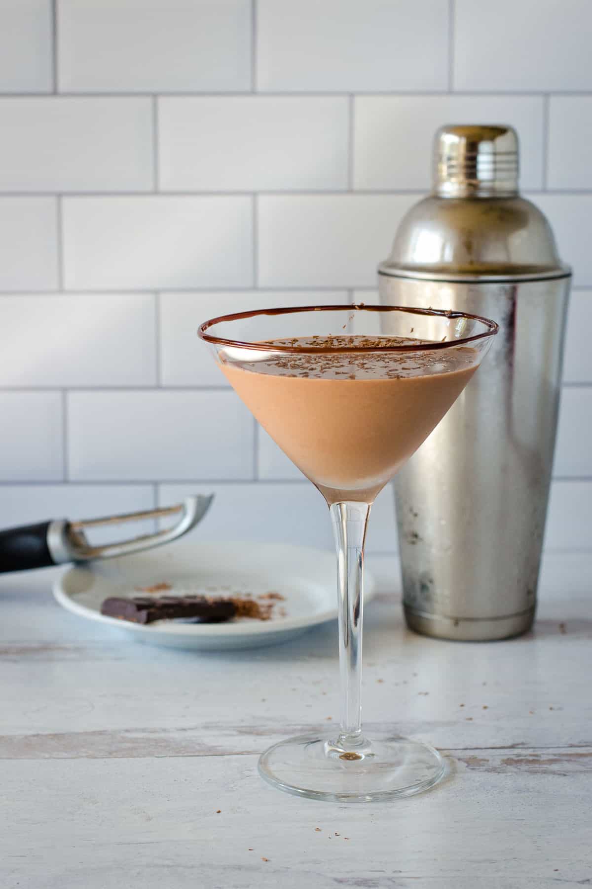 Chocolate martini with chocolate shavings and cocktail shaker