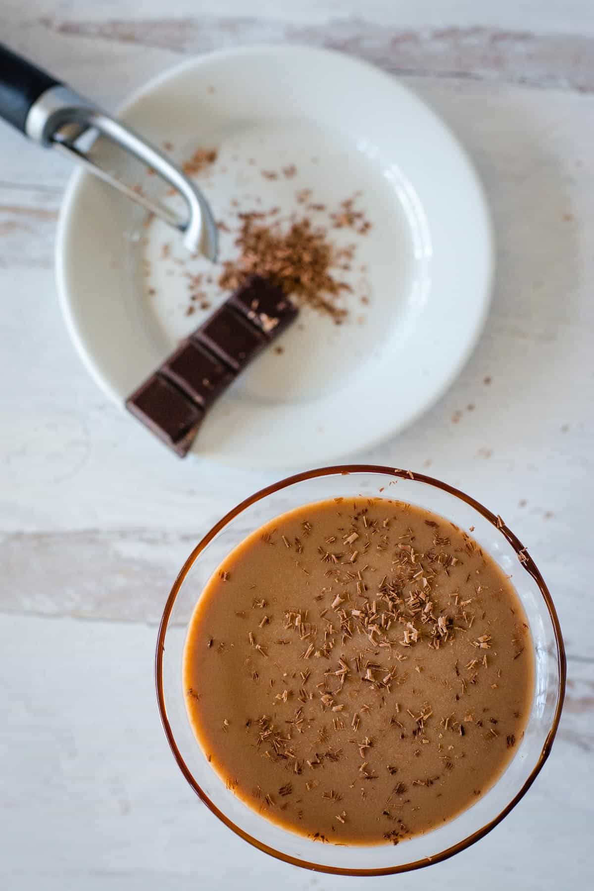 Top view of chocolate martini cocktail with chocolate shavings