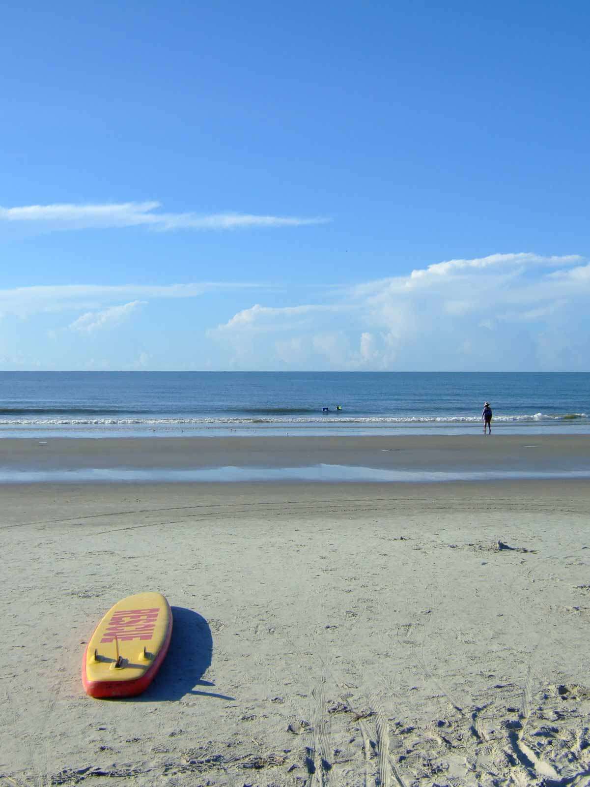 Coligny Beach with paddle board on sand