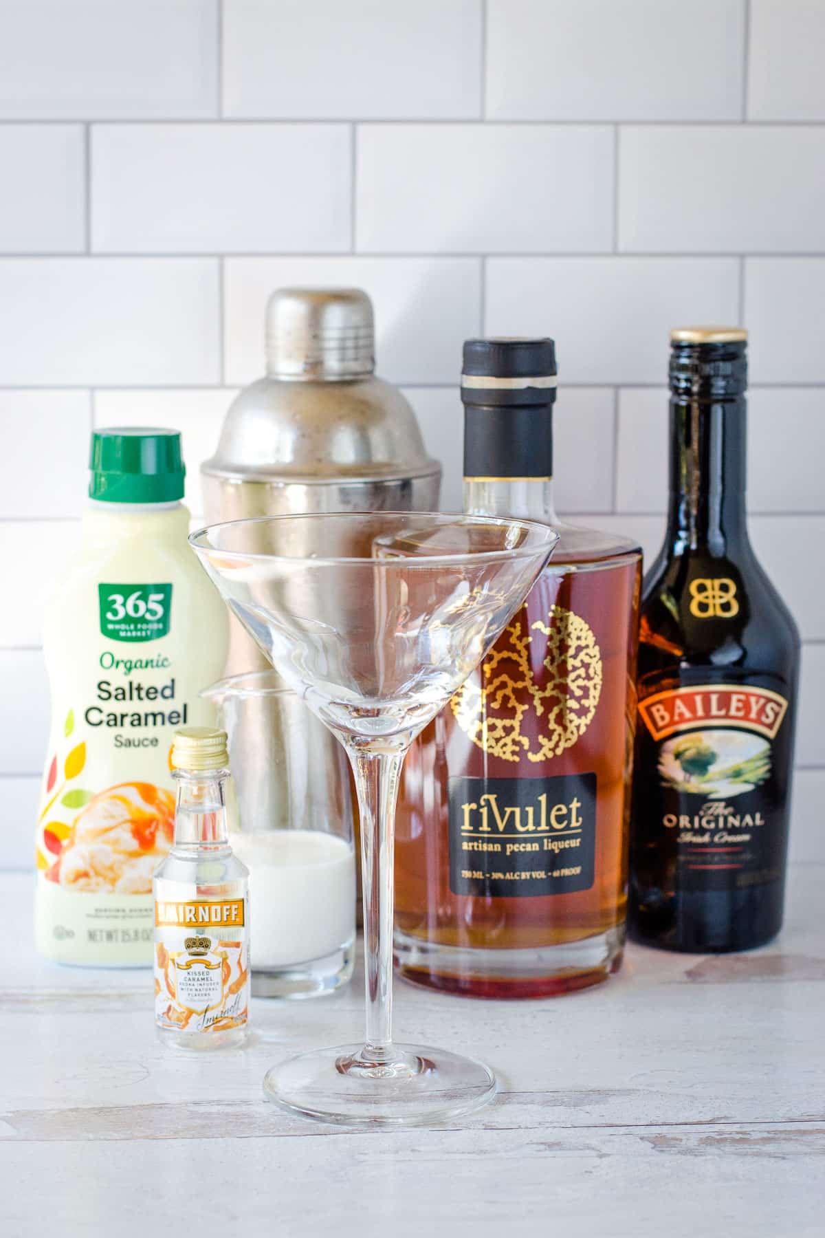 Caramel sauce, cocktail shaker, pecan liqueur, Irish cream, caramel vodka, milk, martini glass.