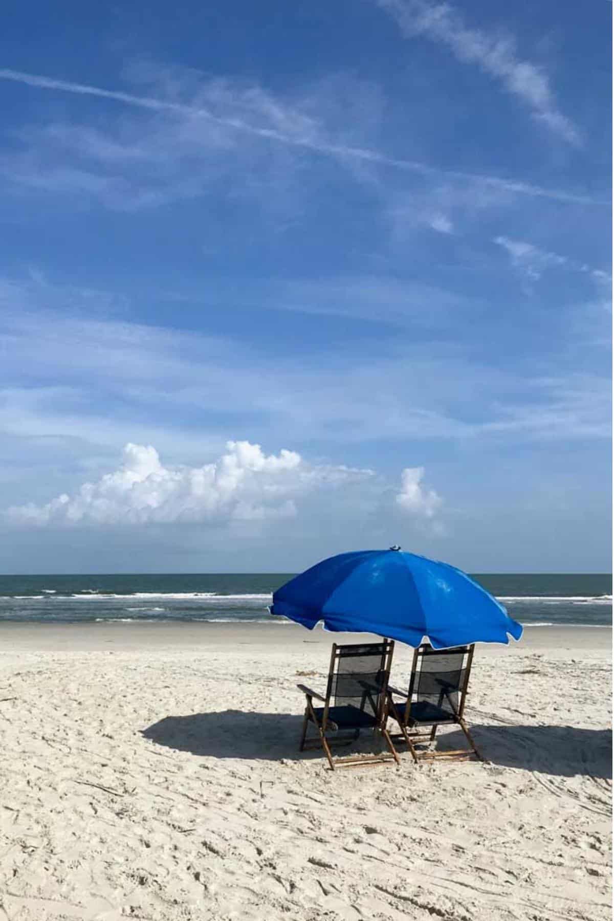 Beach with chairs and umbrella