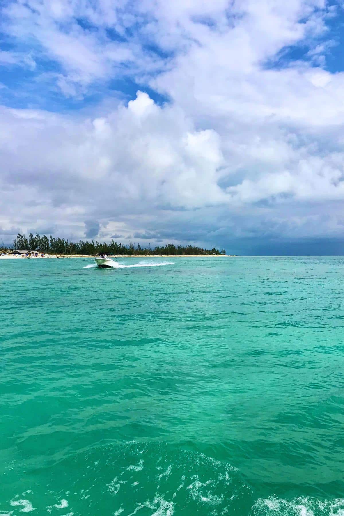 Motor boat on green water in Bahamas