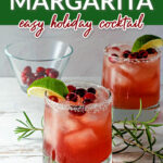Christmas Margaritas with cranberries, lime wedges and rosemary sprigs.