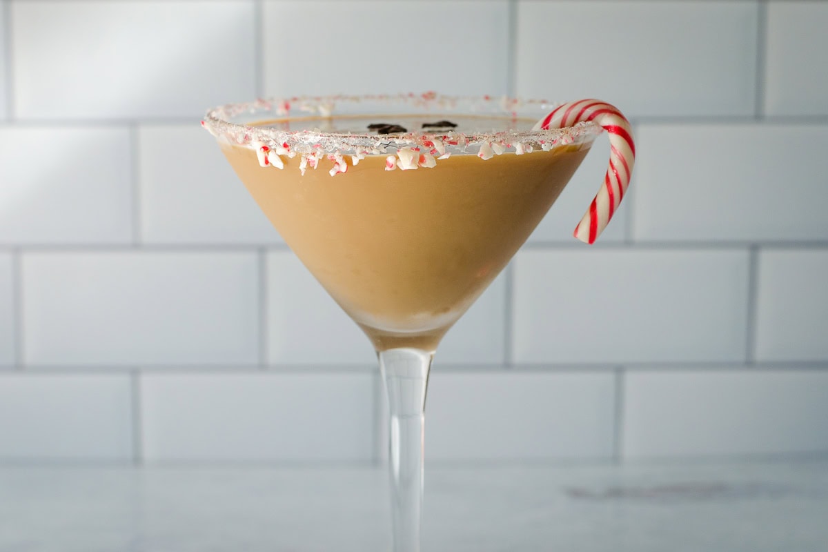 Peppermint espresso martini with a candy cane.