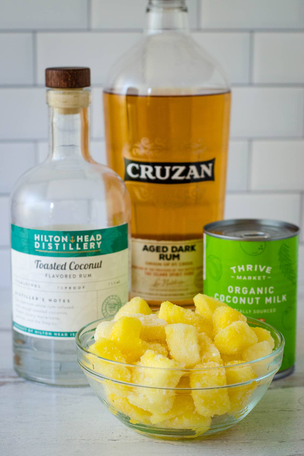 Frozen pineapple, coconut rum, dark rum, and coconut milk.