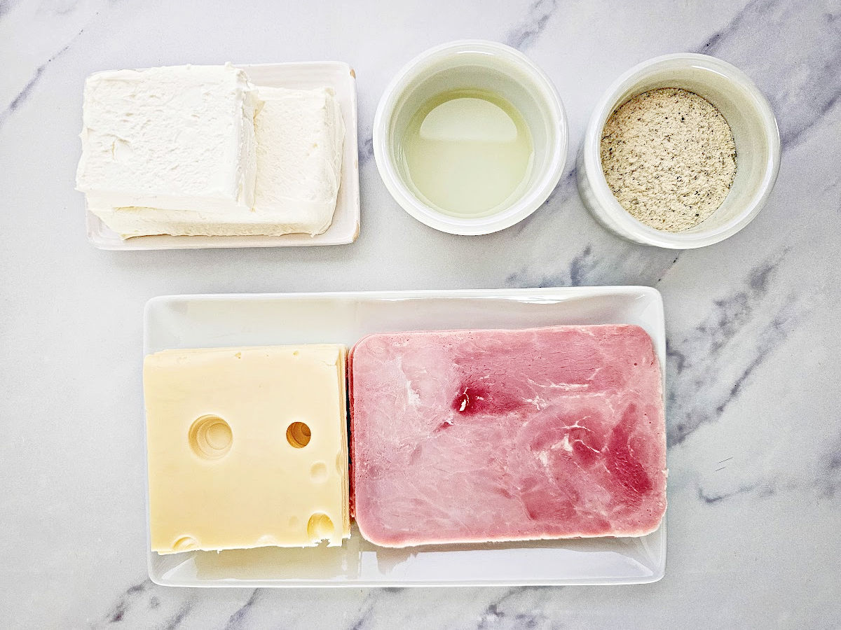 Cream cheese, lemon juice, ranch seasoning, sliced swiss cheese and slices of ham.