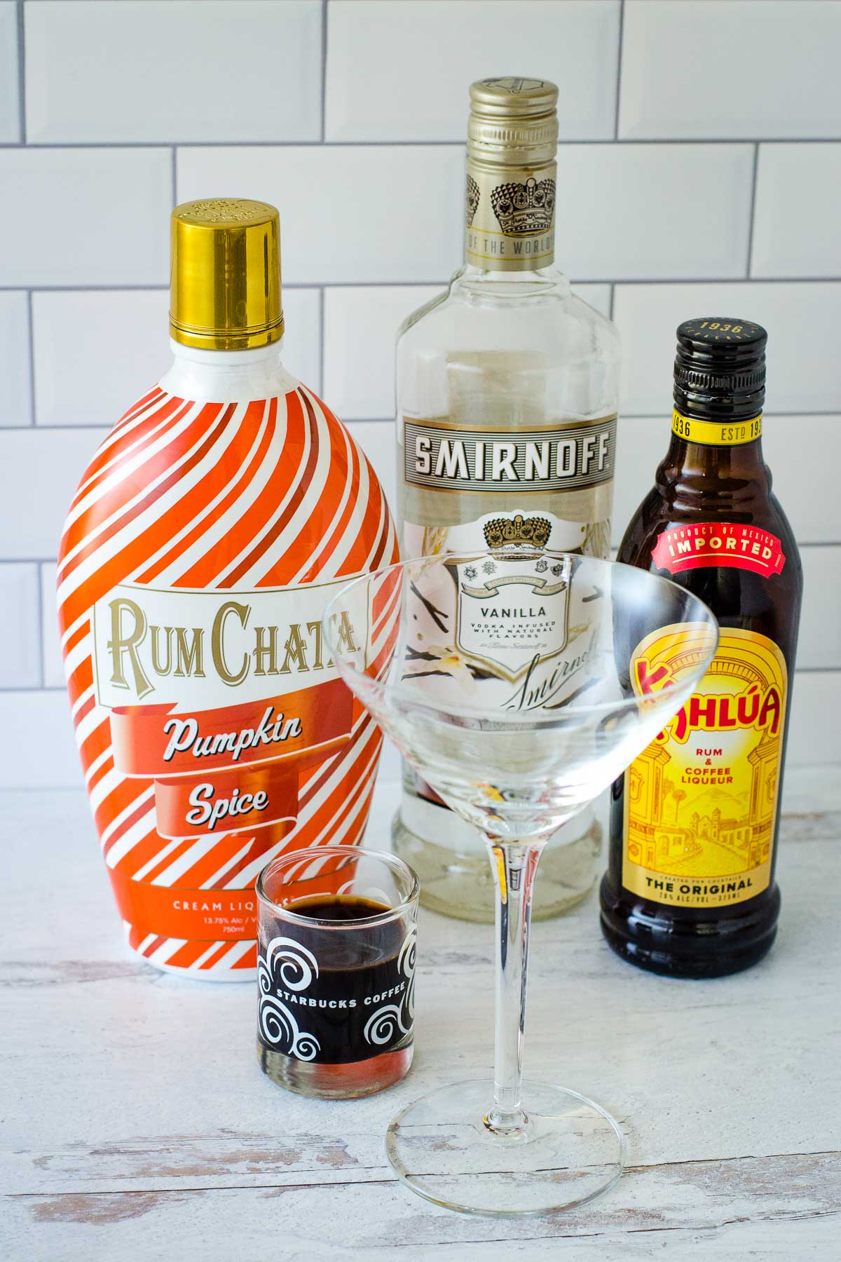 RumChata Pumpkin Spice, Smirnoff vanilla vodka, Kahlua, shot of espresso and cocktail glass.