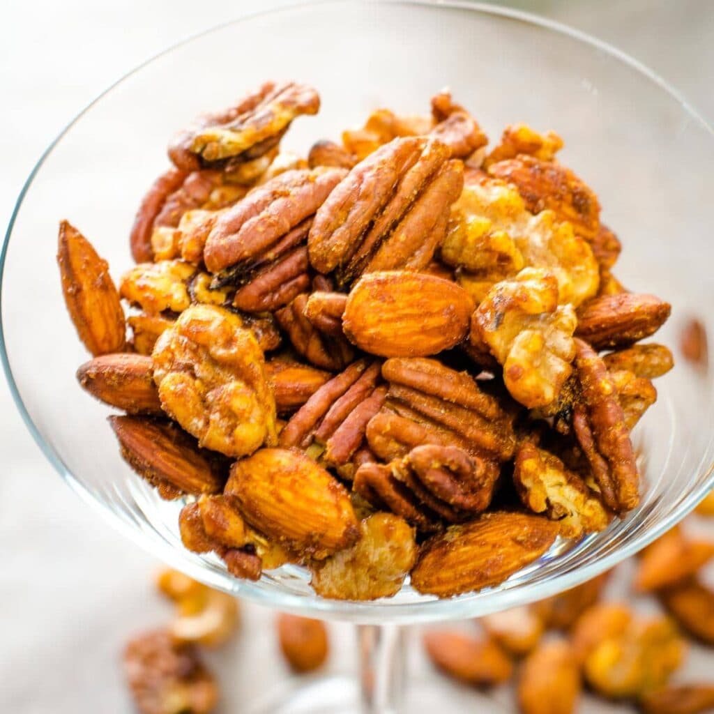 Spiced mixed nuts in glass.