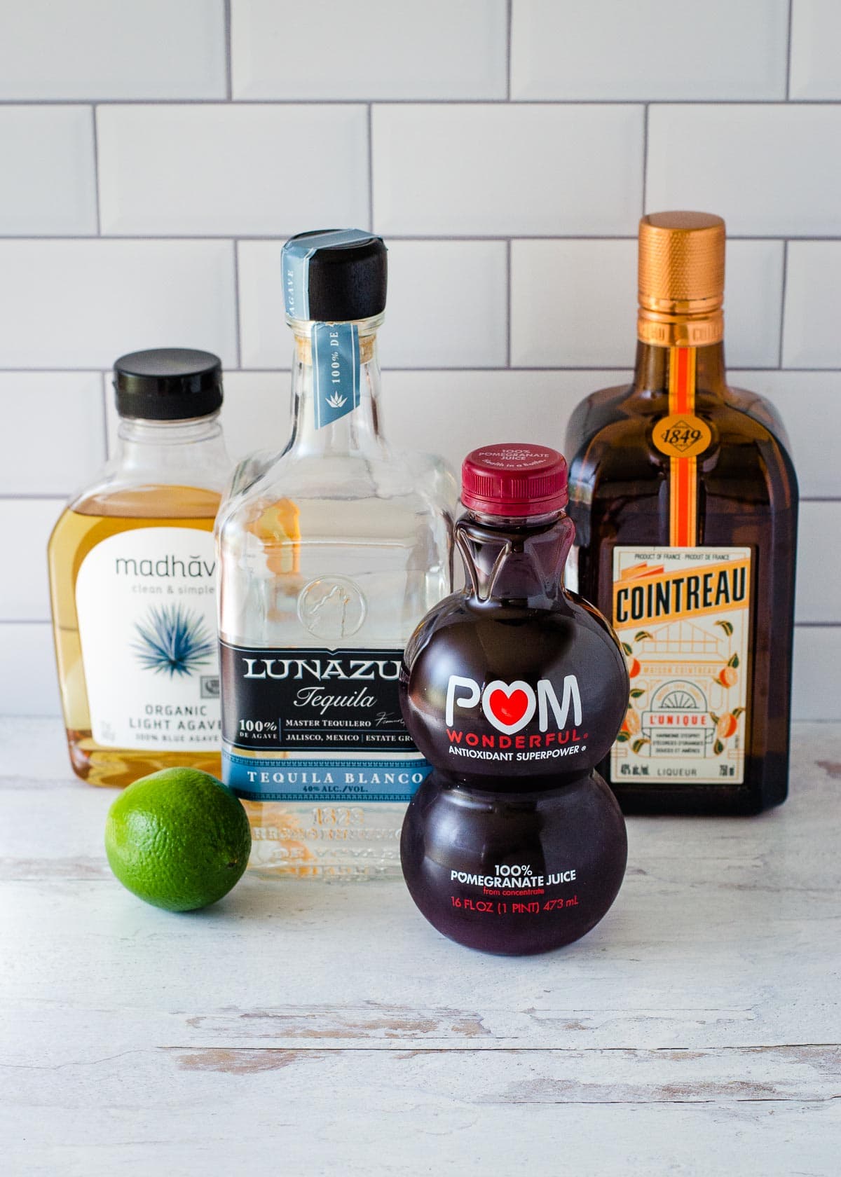 Lime, pomegranate juice, agave, tequila, and orange liqueur.