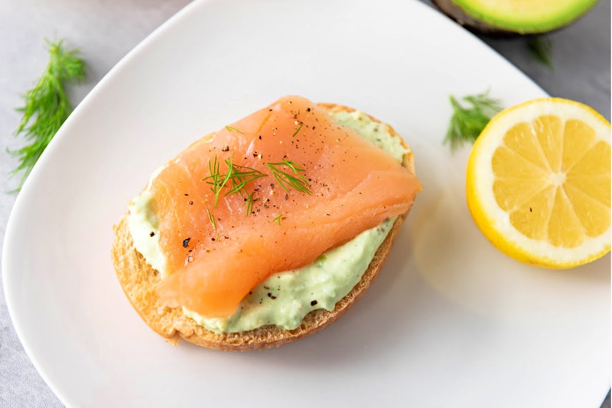 Smoked salmon crostini with avocado cream and fresh dill.