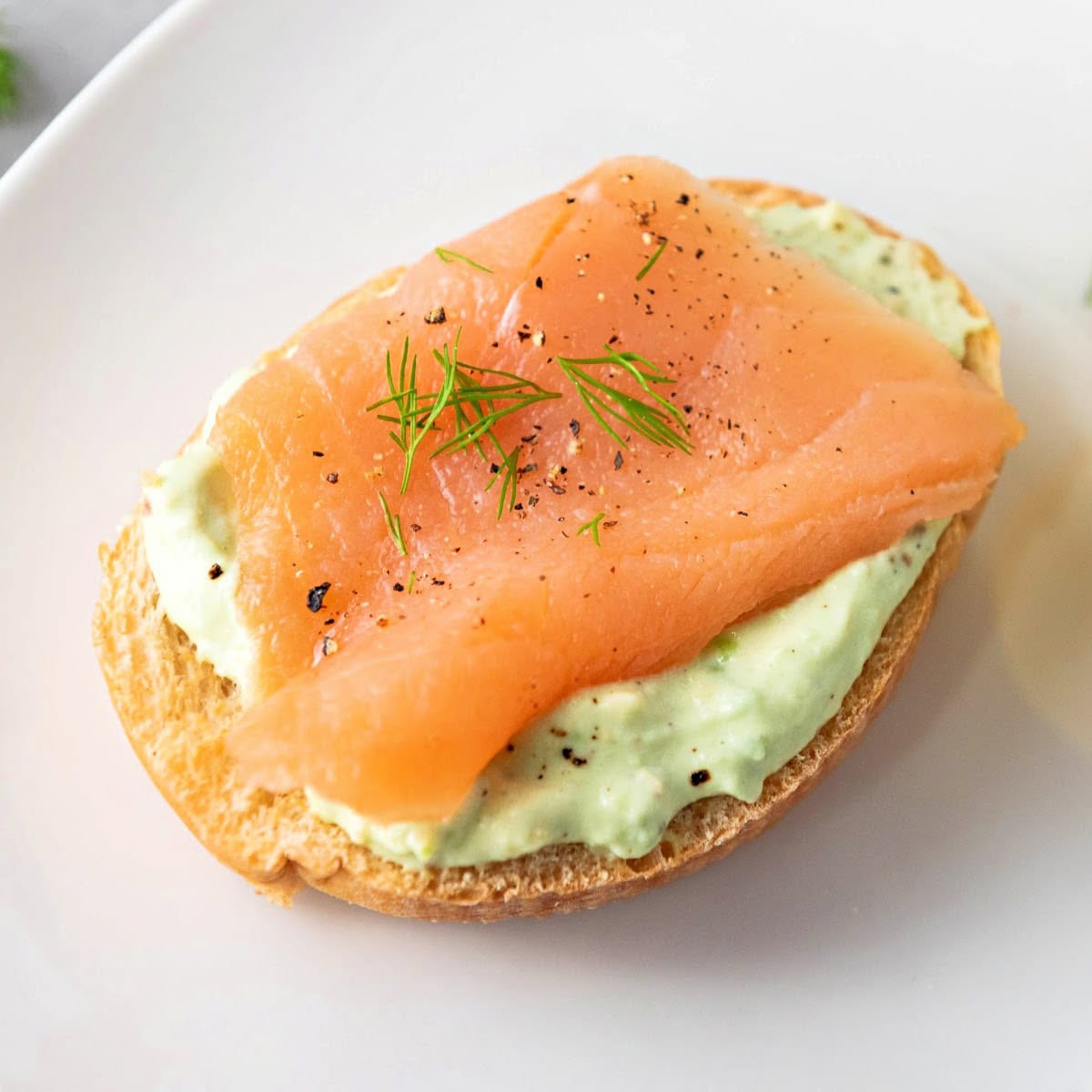 Smoked salmon crostini with avocado cream and fresh dill.