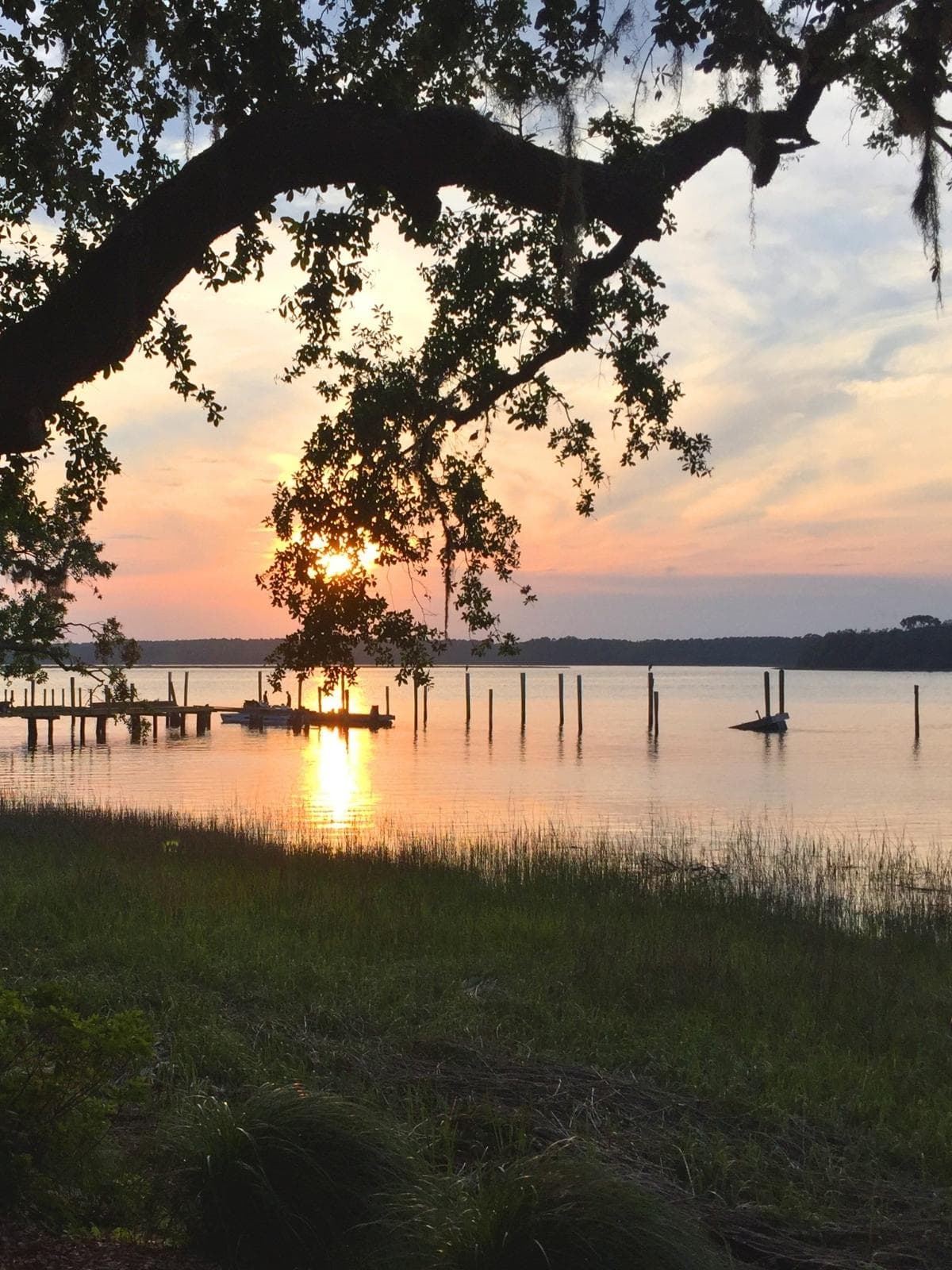 View of the sunset over the water from Skull Creek Boathouse Hilton Head