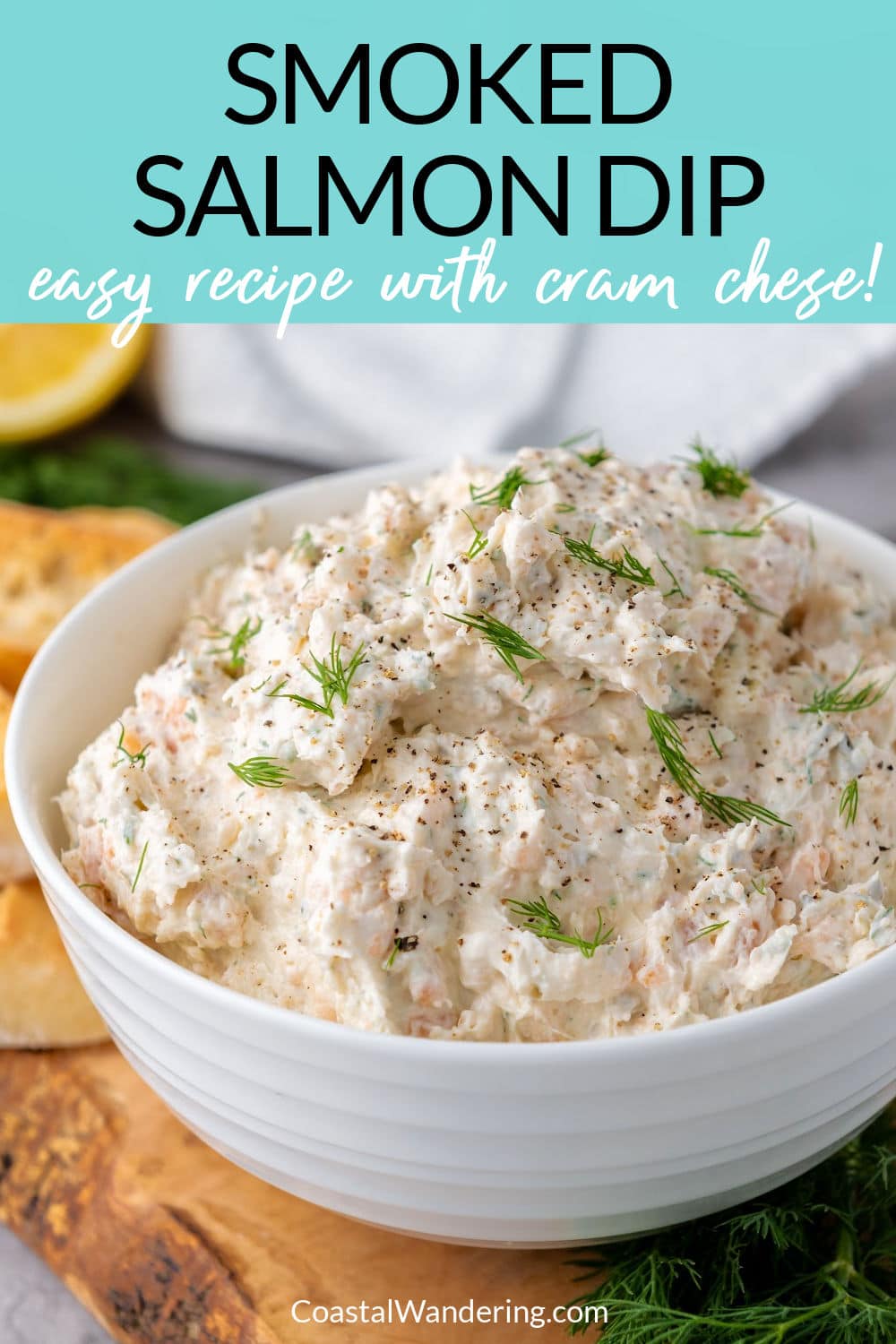 Smoked salmon dip with cream cheese and dill in a white bowl.